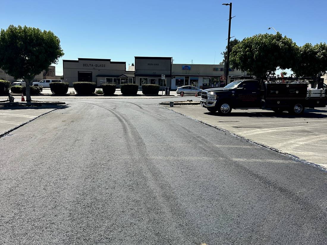 Repaved lane through a parking lot