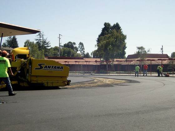 Santana paver machine laying hot mix asphalt