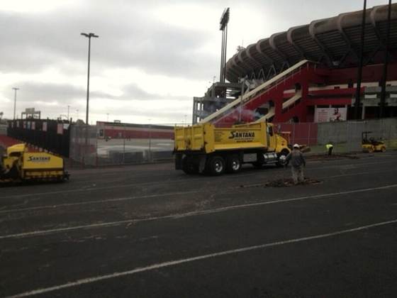 Santana trucks resurfacing a stadium parking lot