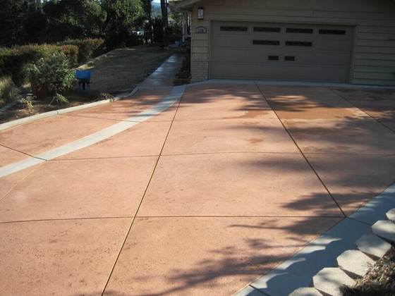 Colored concrete driveway with brushed finish