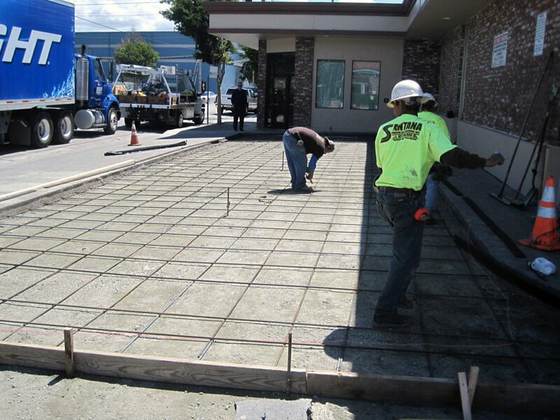 Crew setting a rebar grid before a concrete pour