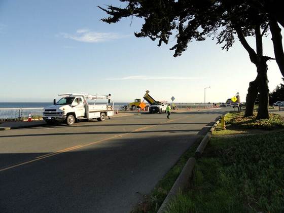 Paving crew working a coastal road