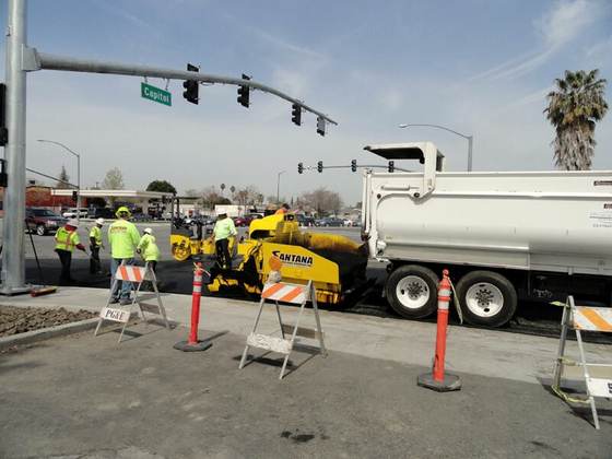 Paving crew rebuilding a city intersection