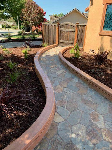 Stamped stone garden path with colored border