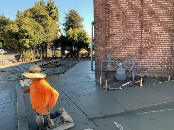 Finisher working a fresh concrete slab