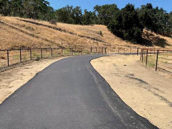 New asphalt trail through open hills